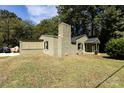 Side view of the house highlighting green brick and landscaping at 1762 Old Carter St, Lancaster, SC 29720
