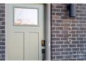 The front door of 459 is painted an on-trend green, with a digital smart lock for modern convenience at 459 Blairhill Rd # 02, Charlotte, NC 28217