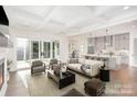 Bright and airy living room featuring an open-concept design with a modern kitchen and access to the outdoors at 1228 Sage Pine Cir # 12, Clover, SC 29710