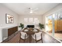 Bright dining area with fireplace and sliding glass doors leading to patio at 3178 Heathstead Pl, Charlotte, NC 28210