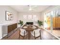 Bright dining room with a round table, fireplace, and patio access at 3178 Heathstead Pl, Charlotte, NC 28210