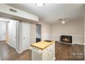 Living room with fireplace and kitchen island at 3178 Heathstead Pl, Charlotte, NC 28210