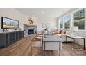 Living Room with stone fireplace and hardwood floors at 117 Brooke Forest Ct, Mooresville, NC 28115