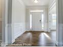 Bright and spacious foyer with hardwood floors and white trim at 3221 Mcharney Dr # 31, Harrisburg, NC 28075