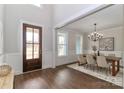 Elegant dining room with hardwood floors, chandelier, and neutral tones creating a sophisticated ambiance at 332 Canvasback Rd, Mooresville, NC 28117