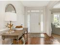 Bright entryway with hardwood floors and console table at 1218 Wareham Ct, Charlotte, NC 28207