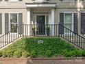 Elegant front entrance with black door and iron railings at 1218 Wareham Ct, Charlotte, NC 28207