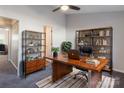 Office space with a large desk, bookshelves, and a comfortable chair, perfect for working from home at 6427 Saint Bernard Way, Charlotte, NC 28269