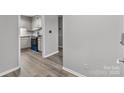 View of kitchen with stainless steel appliances and wood-look flooring at 140 Lake Concord Ne Rd # D9, Concord, NC 28025