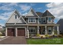 Charming two-story home featuring stone accents, three gables, and a covered front porch at 837 Lake Forest Dr # Nottingham, Belmont, NC 28012
