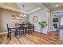 Dining room with hardwood floors, chandelier, and wall art at 12528 Generations St, Charlotte, NC 28278