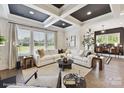 Bright living room with coffered ceiling, large windows, and stylish neutral decor at 3020 Endhaven Terraces Ln # 10, Charlotte, NC 28277
