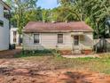 Backyard of the house, mostly dirt and grass at 2117 Laburnum Ave, Charlotte, NC 28205