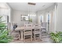 Elegant dining room with modern chandelier, neutral walls, and seating for six at 236 Pinnacle Xing, Shelby, NC 28152
