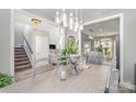 Elegant dining room with modern chandelier and seating for six at 236 Pinnacle Xing, Shelby, NC 28152