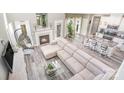 Airy living room features a fireplace, modern furniture, and view into the kitchen at 236 Pinnacle Xing, Shelby, NC 28152