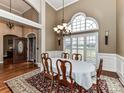 Elegant dining room with hardwood floors and chandelier at 4730 Rollins Pointe Dr, Monroe, NC 28110