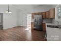 Modern kitchen with stainless steel appliances and wood cabinets at 225 York Ave, Kannapolis, NC 28083