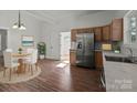 Bright kitchen boasts stainless steel appliances and wood cabinets at 225 York Ave, Kannapolis, NC 28083