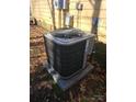 Outdoor air conditioning unit sitting on a concrete pad at 3710 Burntwood Ct, Charlotte, NC 28227