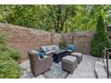 Cozy patio with seating area nestled within a brick wall at 5942 Carmel Rd, Charlotte, NC 28226