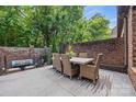 Outdoor dining area on a spacious patio with seating at 5942 Carmel Rd, Charlotte, NC 28226