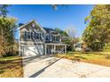 Two-story gray house with white garage door and blue shutters at 621 Seldon Dr, Charlotte, NC 28216