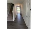 Entryway with gray flooring, stairs and white trim at 1313 Dodd St, Shelby, NC 28152
