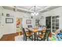 Bright dining room with a coffered ceiling, wood floors, and a dining table set for four at 422 Lee Ave, Wadesboro, NC 28170