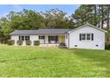 White brick ranch house with a grassy yard and mature trees at 2178 Eastview Rd, Rock Hill, SC 29732