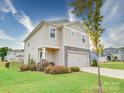 Two-story house with stone accents and landscaping at 102 Guardian Gate Dr, Mooresville, NC 28115