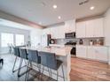 Modern kitchen with white cabinets and granite countertops at 102 Guardian Gate Dr, Mooresville, NC 28115