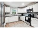 Modern kitchen with stainless steel appliances, white cabinets and granite countertops at 317 Annafrel St, Rock Hill, SC 29730