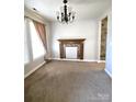 Dining room with a decorative fireplace and hardwood floors at 1561 Wilburn Park Ln, Charlotte, NC 28269