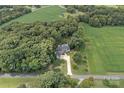 Aerial view showcasing the house, pool, expansive property, and surrounding landscape at 162 Hoover Rd, Troutman, NC 28166