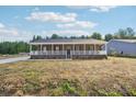 Charming brick home featuring a covered front porch perfect for relaxing and enjoying the outdoors at 745 Grier St, Rock Hill, SC 29730