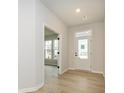 Bright entryway with light flooring and a view into a light-filled living area at 10507 Boudreaux St, Huntersville, NC 28078