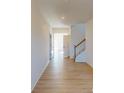 Bright entryway with light hardwood floors and staircase at 1800 Augustine St, Monroe, NC 28112