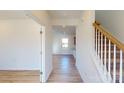 Bright entryway with hardwood floors and staircase at 1809 Augustine St, Monroe, NC 28112