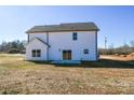 Rear view of the house showcasing a patio and landscaping at 7805 Medlin Rd, Monroe, NC 28112