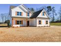 Two-story house with white siding, brown roof, and orange shutters at 7805 Medlin Rd, Monroe, NC 28112