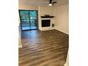 Living room featuring a fireplace and sliding glass doors to a patio at 11052 Cedar View Rd, Charlotte, NC 28226