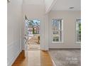 Inviting entryway with hardwood floors and view of the home's exterior at 2715 Ballade Dr, Matthews, NC 28105