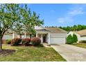 Attractive ranch-style home with a covered porch and well-manicured lawn at 2024 Holly Villa Cir, Indian Trail, NC 28079