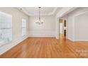 Spacious dining room featuring hardwood floors and chandelier at 3015 Duclair Ln, Fort Mill, SC 29707