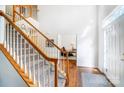 Bright entryway showcasing hardwood floors, carpeted stairs with white rails, and adjacent office space at 138 Huntly Ln, Mooresville, NC 28115