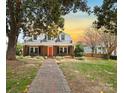 Brick home with a walkway leading to the front door at sunset at 515 S Academy St, Lincolnton, NC 28092