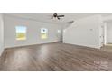 Bright living room featuring hardwood floors and white walls at 4122 Old Monroe Marshville Rd, Wingate, NC 28174