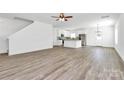 Bright open-concept living and kitchen area with new flooring and fresh paint at 4122 Old Monroe Marshville Rd, Wingate, NC 28174