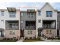 Stylish three-story townhome featuring a brick facade and modern architectural details at 432 Nathaniel Way # Brx0043, Charlotte, NC 28213